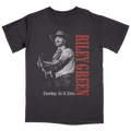 Black t-shirt with a graphic of a cowboy holding a guitar and the text 'Riley Green Cowboy As It Gets' on a white background.