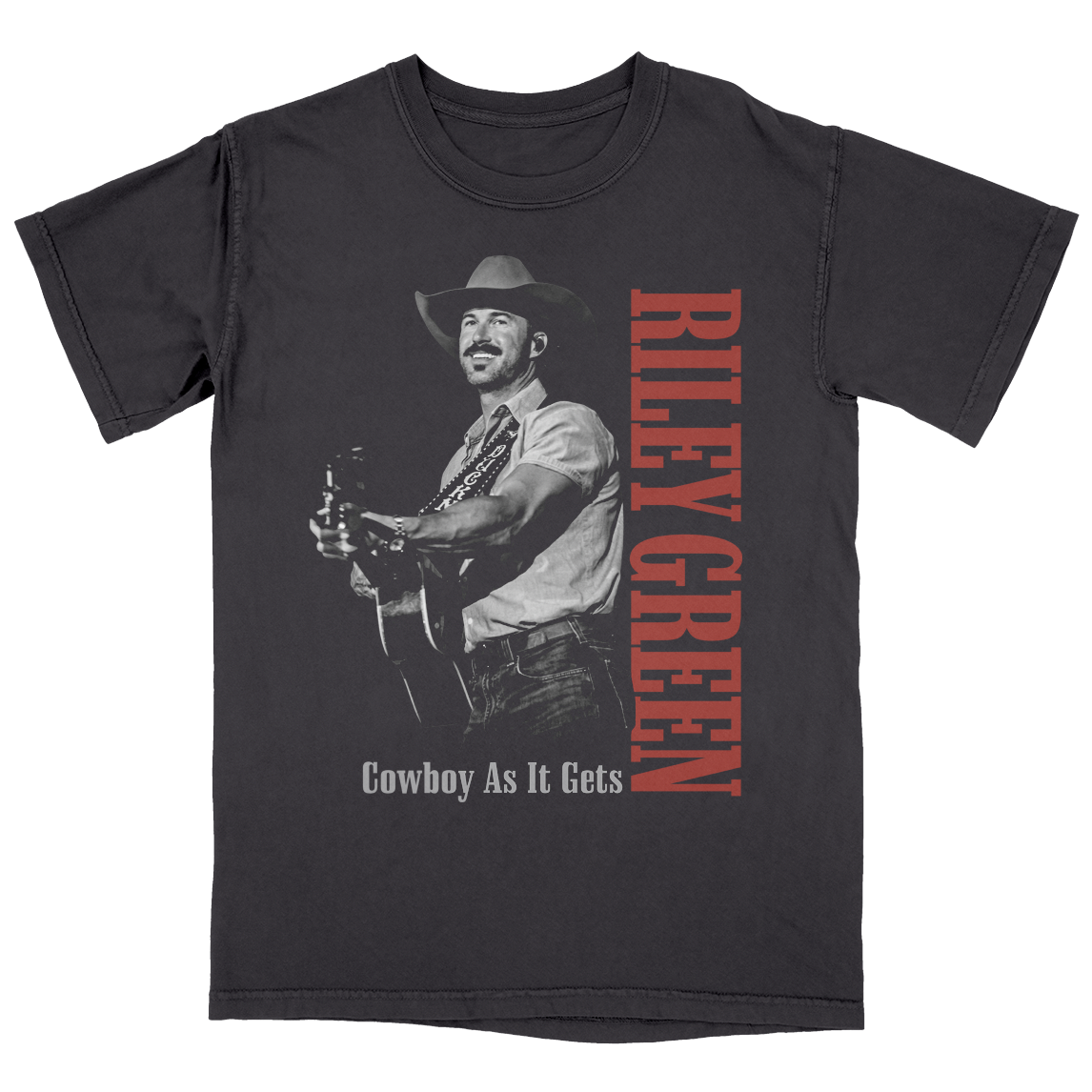 Black t-shirt with a graphic of a cowboy holding a guitar and the text 'Riley Green Cowboy As It Gets' on a white background.