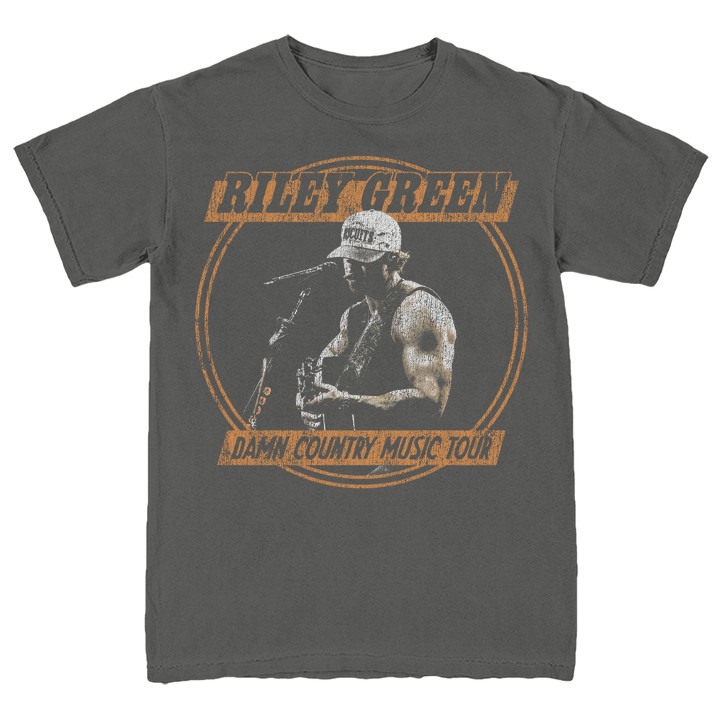 Gray t-shirt with a graphic of a person playing guitar and text 'Riley Green Damn Country Music Tour' on a white background.